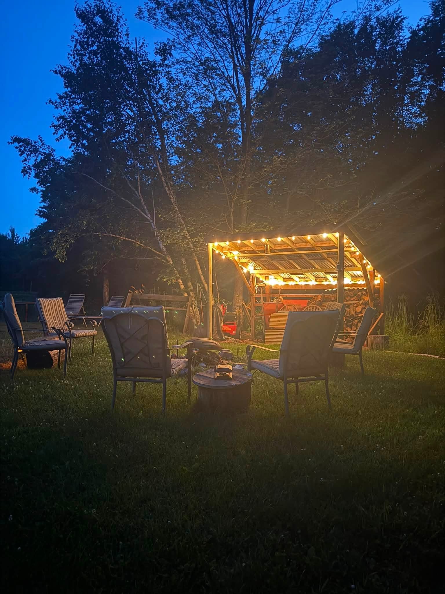 String lights over the pergola at dusk across the whole retreat